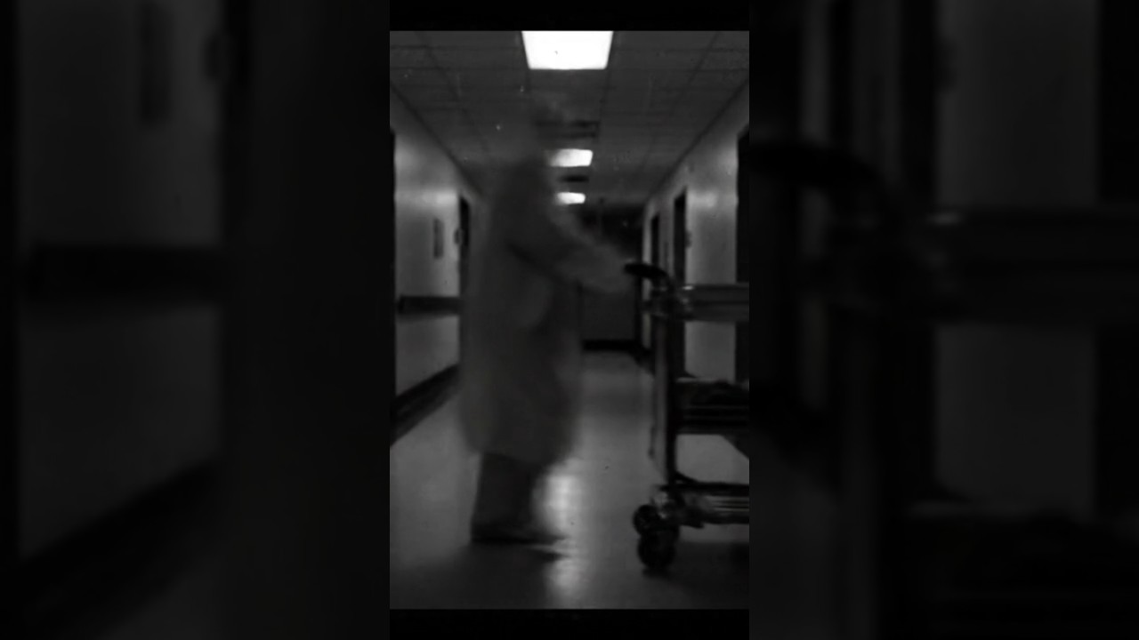 “Grainy CCTV footage in hospital corridor at night 
