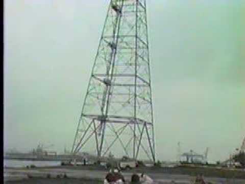 From 1993. Please excuse the video quality. The original master was lost, and this is off of a vhs backup copy I made back then. The Port of Tacoma decided to eliminate two 200 foot power transmission towers. One on each side of the Blair waterway for container expansion. The tower was to fall with the pull of a tractor. Instead, the legs twisted, and it momentarily looked like it was going to come towards us. With another presuasive tug, the tower did what it was suppose too. It's not as cool as an implosion, but it's still fun to watch! Enjoy!