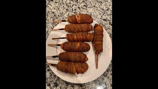 Smoked bacon wrapped corn dogs on the Weber Kettle 22! Totally a win baby!