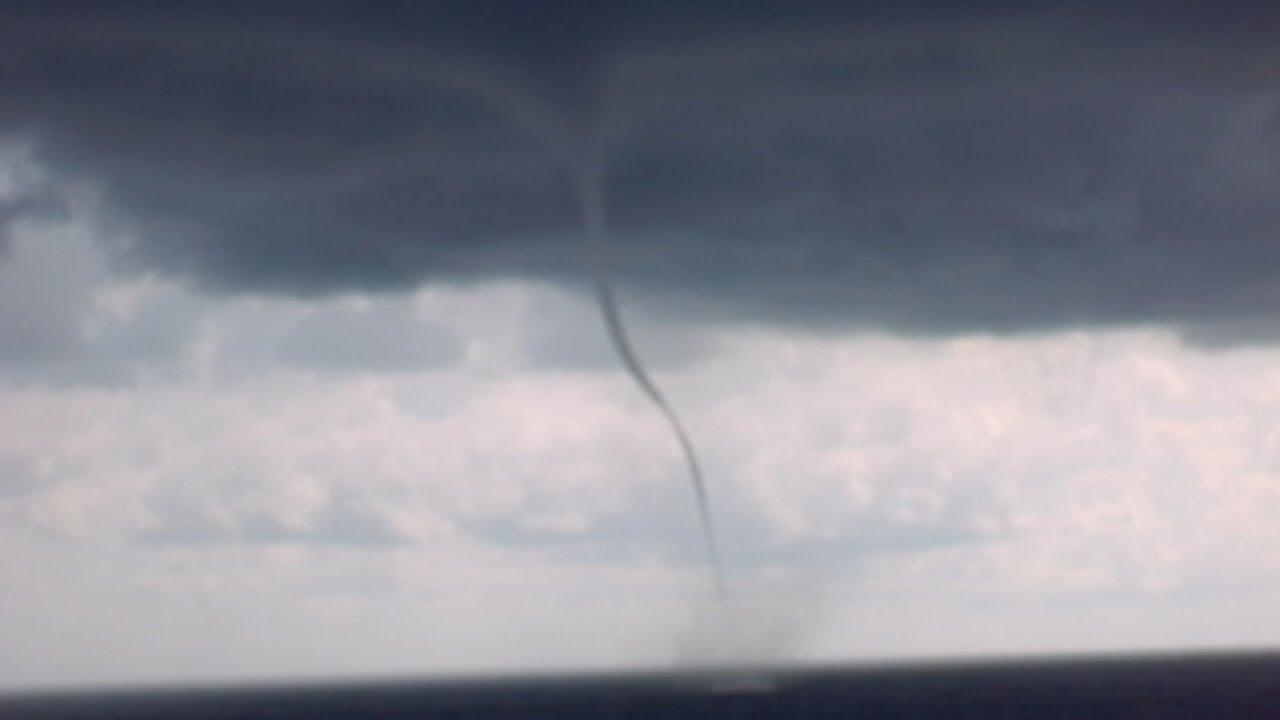 watershed Cruise Ship sails between TORNADO FUNNEL CLOUDS! Close Call!