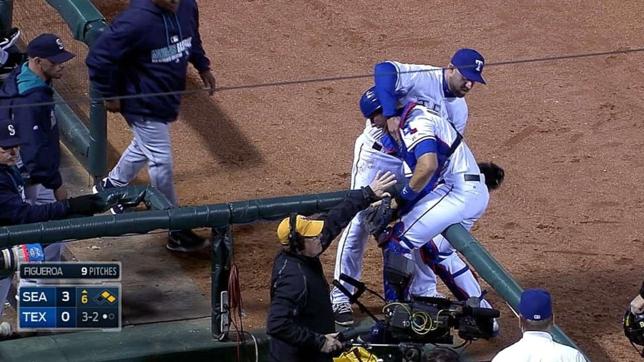 Arencibia almost falls in camera well