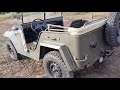 GAZ-67 Soviet jeep from 1943 driving in the forest