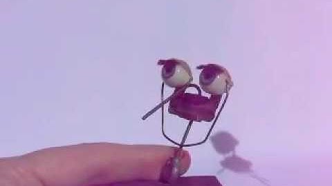 Weighted mechanism for "sleepy" doll eyes