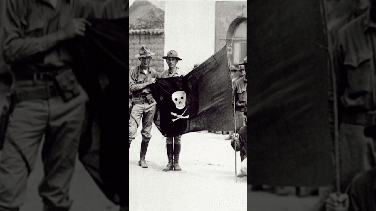 United States Marines with the captured flag of Augusto César Sandino in 1932.