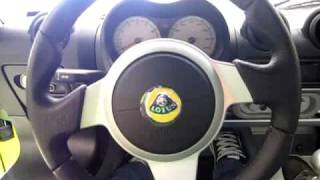 Player Profile Sitting In A Lime Green Lotus Exige