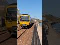GWR class 165 rattling down the seawall at coastguards-Exmouth to Paignton service 165101 DMU