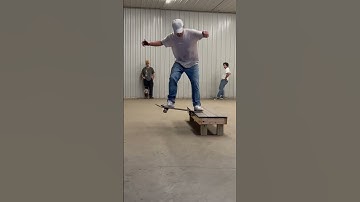 Nose slide nollie flip