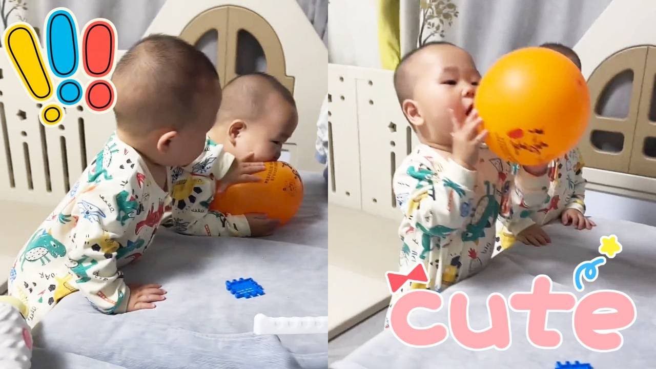 Two children were fighting over a balloon, and they were both complaining to each other.