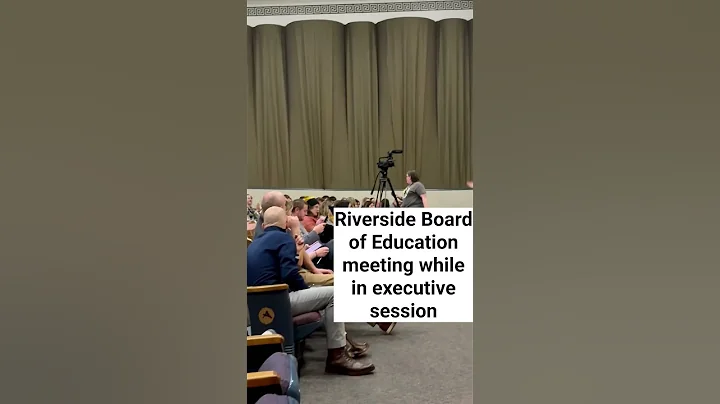 Riverside Board of Education meeting attendees break into Christmas carols