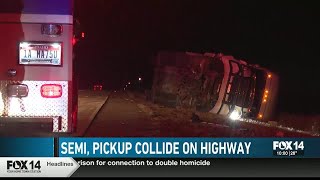 Semi-truck flips onto its side along Interstate 84