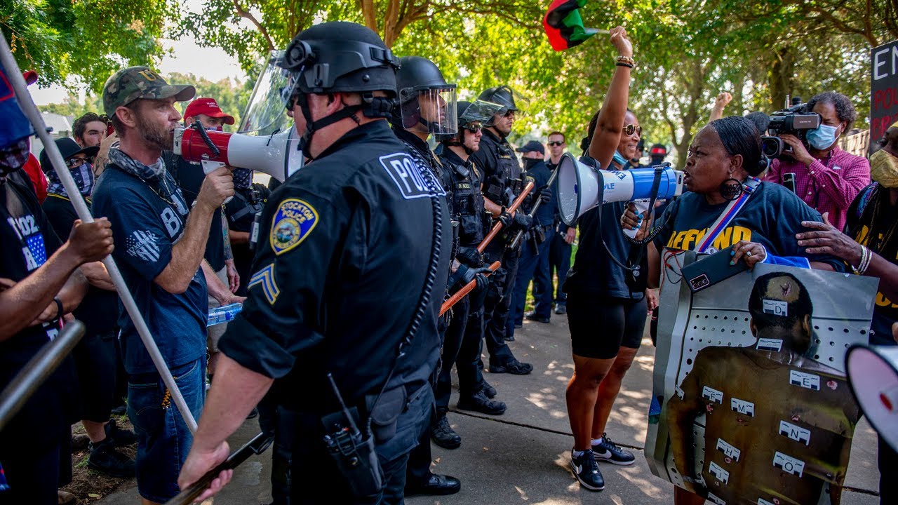 See Black Lives Matter protesters clash with Trump supporters at defund police rally