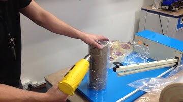 Shrink wrapping tape with I-bar sealer and heat gun