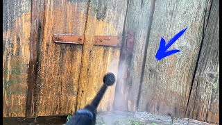 Cleaning an old building with a pressure washer