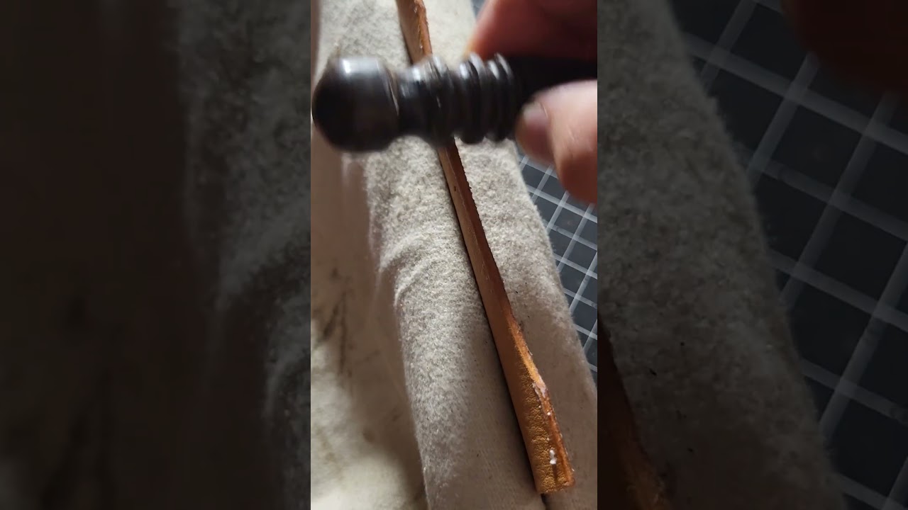 Refining the edge through meticulous burnishing.  #leathercraft #leather #luxury