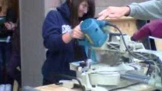 Cailee and her boobs cutting wood