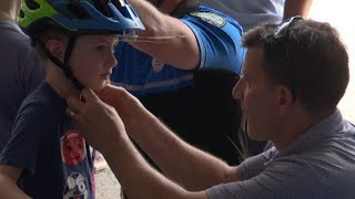 Potsdam police, law firm team up to give away bike helmets