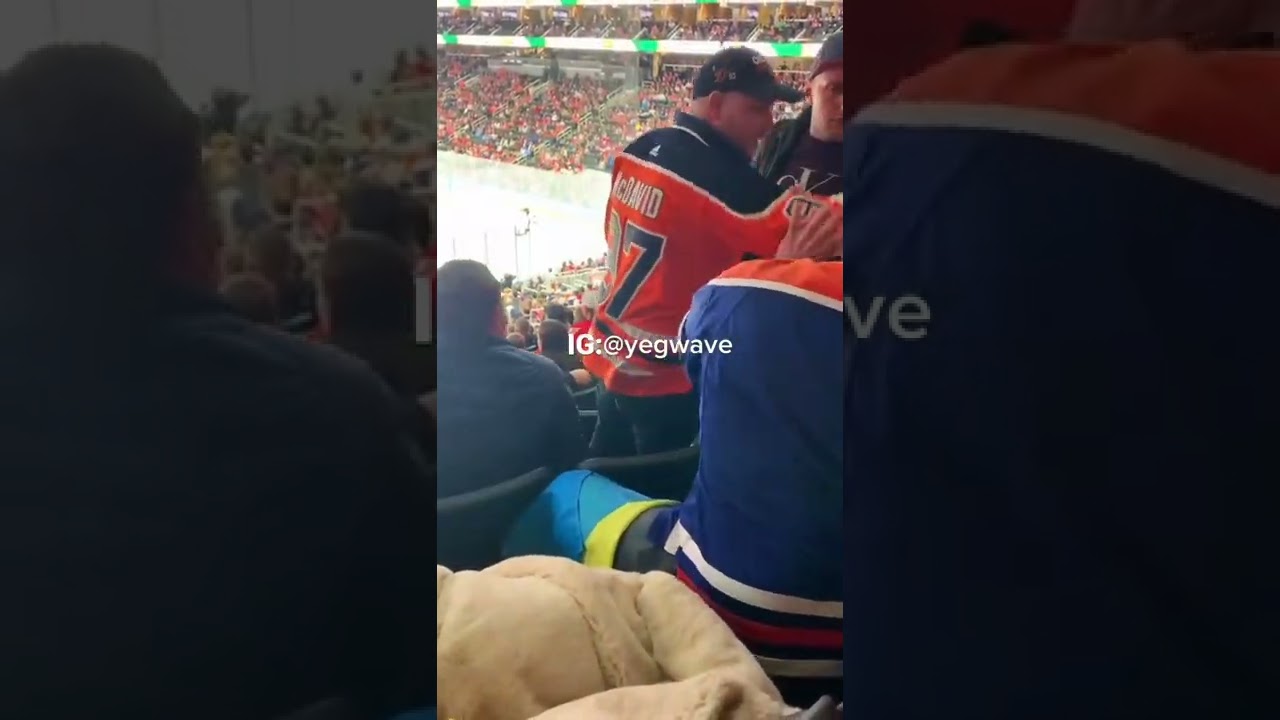 Fan Waving Russian Flag At An Oilers Game Gets Into A Confrontation With A Man Waving Ukraine Flag