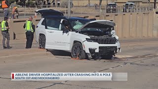 Abilene driver hospitalized after striking pole, falling onto underpass due