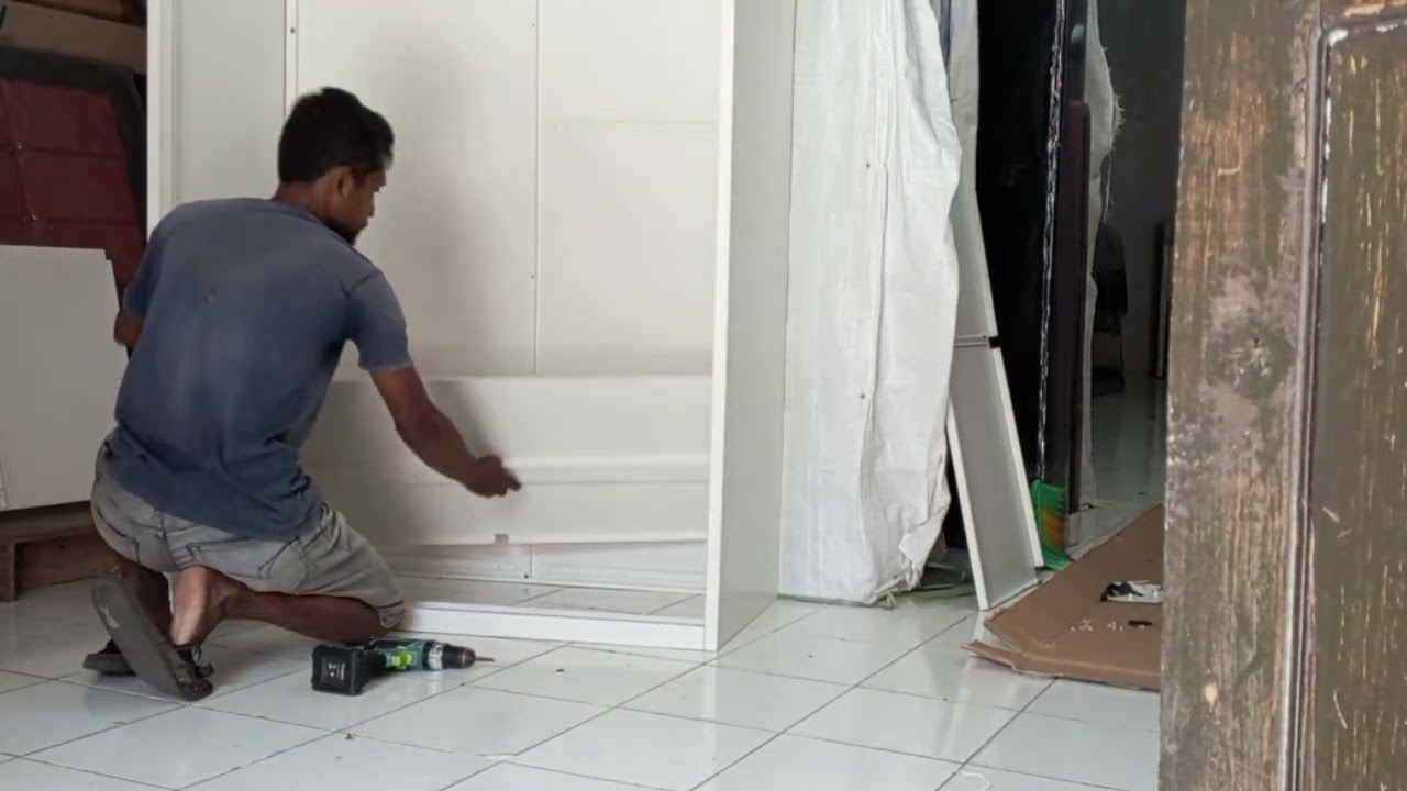 cara  merakit lemari besi 2 pintu sliding