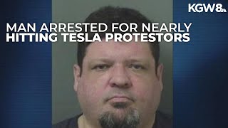 Florida man faces charges after nearly hitting protesters outside Tesla store