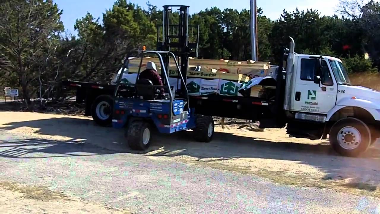 Flatbed Truck Delivering Wood With A Forklift Youtube