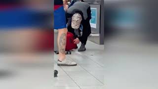 Hilarious video shows plane passenger smashing suitcase in order to fit airline's size requirements screenshot 1