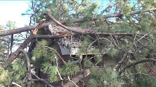 Rapid City family helps neighbor clear out house debris in windstorm aftermath