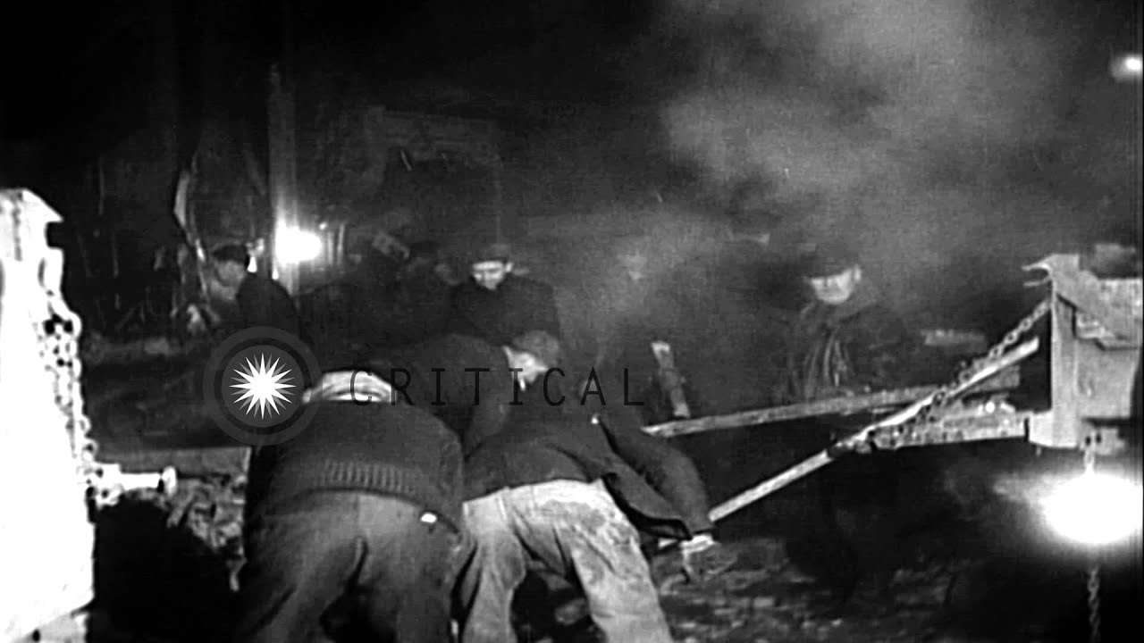 Firemen douse fire on a three-storey building, and the front wall of the blazing ...HD Stock Footage