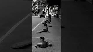 Chest-deep sidewalk shelters during an air raid alert Hanoi, North Vietnam, 1967.