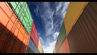 Stacks of Shipping Containers Under Afternoon Cloudscape Seamless Loop | Motion Graphics -