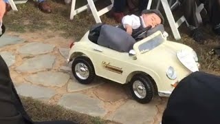 9-Month-Old Ring Bearer Steals The Spotlight as He Sleeps His Way Down The Aisle