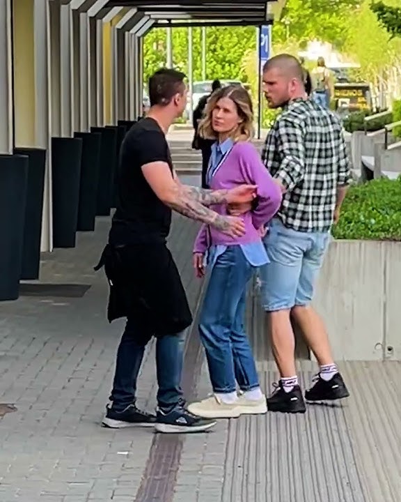 A young woman send a signals for help