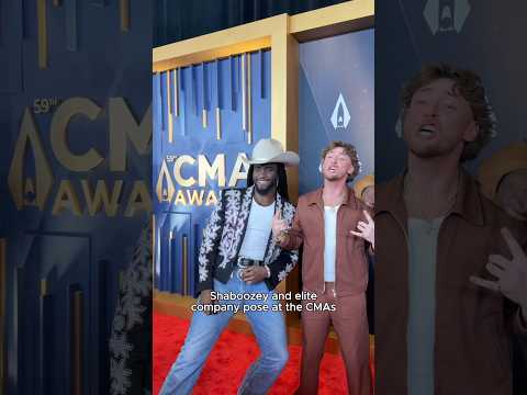 Shaboozey And Elite Company Pose At The CMAs 