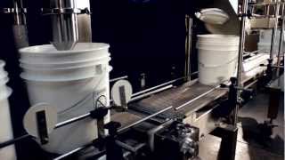 Famous Pacific Packaging - Inline Filling & Lidding System, Single Station Net Weight for Yogurt Pails Profile