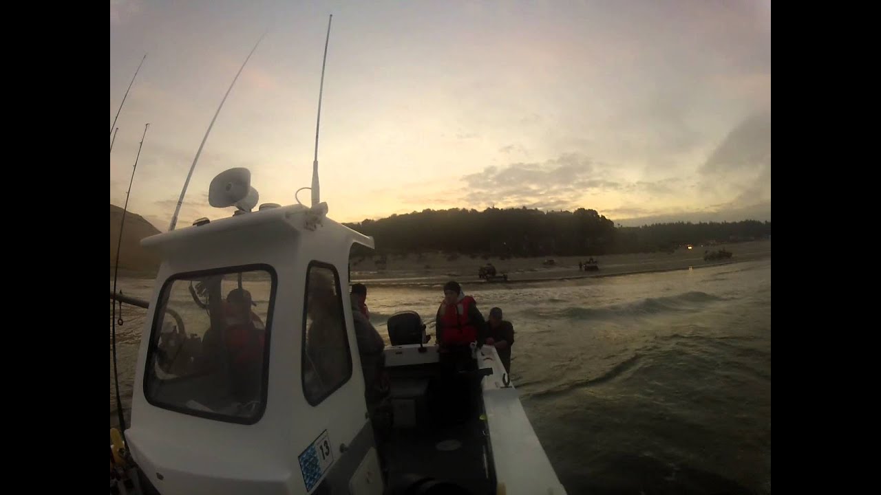 Launching dory boat in Pacific city Oregon with