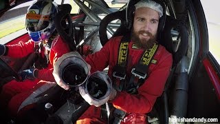 Holding three pints of Black Samba in a race car