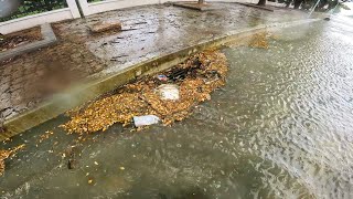 Working In The Rain To Unblock The Drain For No Flooded Streets