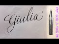 With a Japanese sharp pen, ZEBRA G, I write the name Giulia in calligraphy handwriting.
