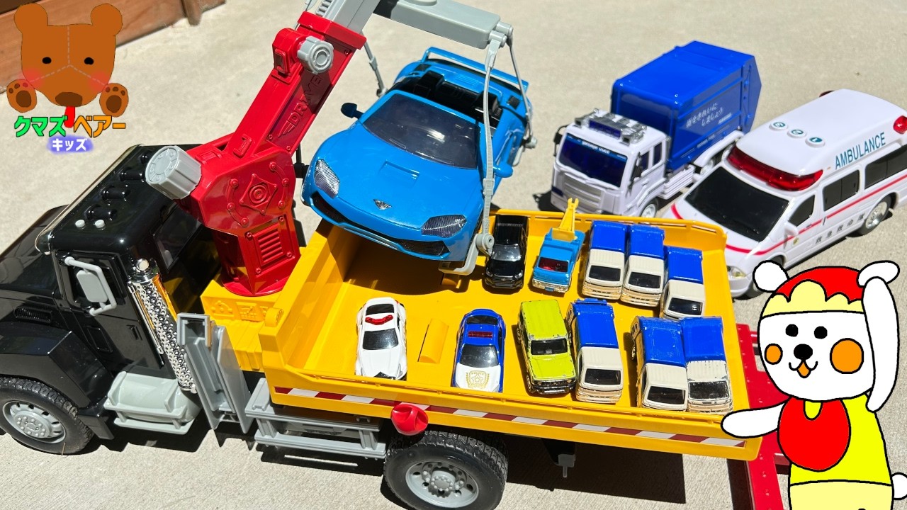 大きな牽引車が壊れた車たちを修理場に連れていくよ