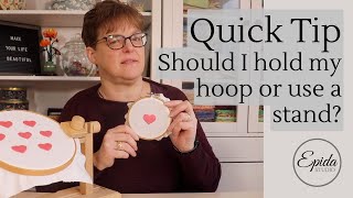 Should I stitch with my hoop in my hand or use a stand to hold it?