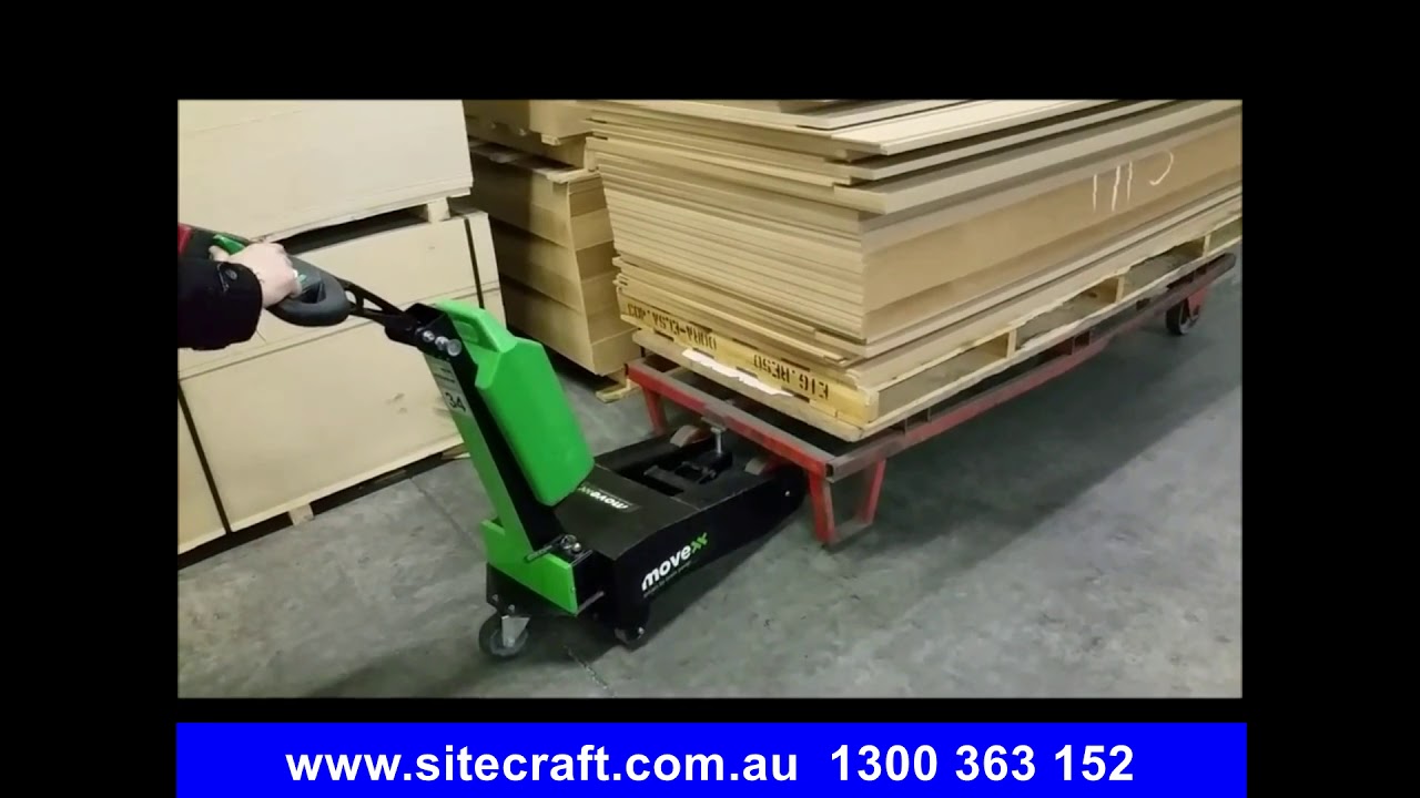 Movexx T1000-P Battery Electric Tow Tug Moving A Timber Transport Trolley