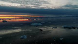 Arctic Serenity: Majestic Iceberg Drift with Oceanic Symphony 🌊🧊