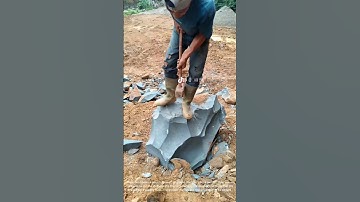 Stone Splitting Mastery: Man Breaks Massive Rock with Sledgehammer