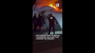 Bystanders rush to rescue passengers on plane that crashed on highway