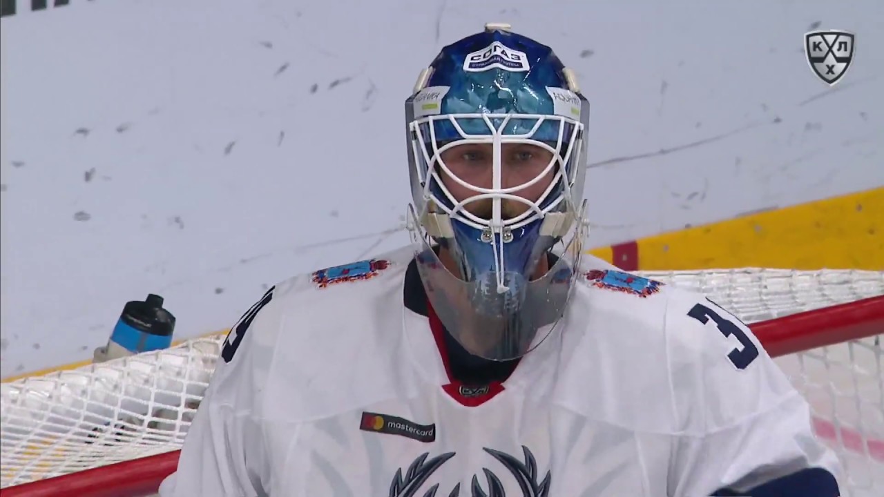 Lindback saves it with his goalie stick