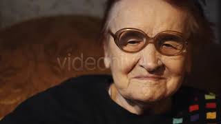 Elderly Woman Putting On Glasses - Stock Footage from Videohive