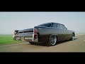 Metalworks black 1965 Lincoln Continental build. Bagged on Rushforth wheels. Suicide slab Lincoln.