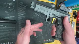 Stock Beretta SAO trigger vs. 2Patriots XXX pre- and over-travel comparison.