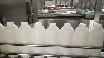 Filling-capping-aluminum foil sealing (manipulator add cap)