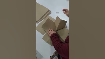 Manual folding of paper bag packaging